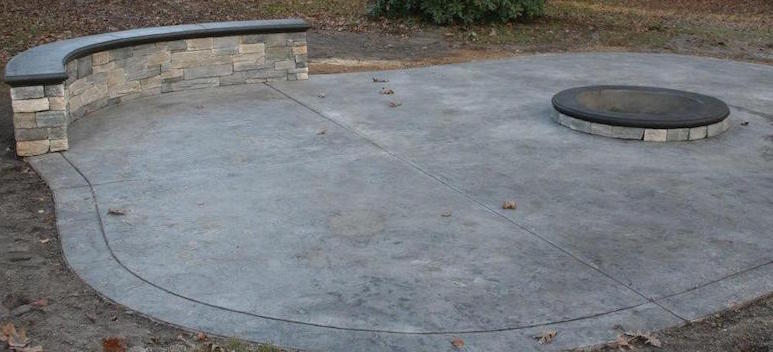 stamped concrete, fire pit and retaining wall